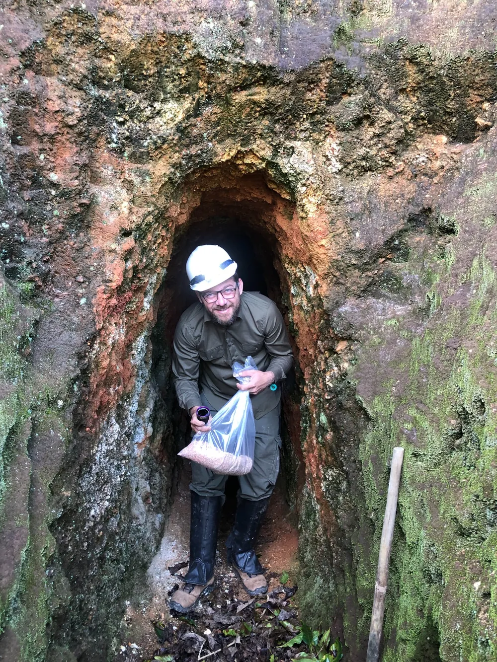 Atlantico field geologist collecting samples from an artisanal tunnel exposure at Novo Cruzeiro.