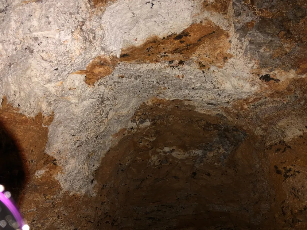 Pegmatite and schist contact showing textural contrast