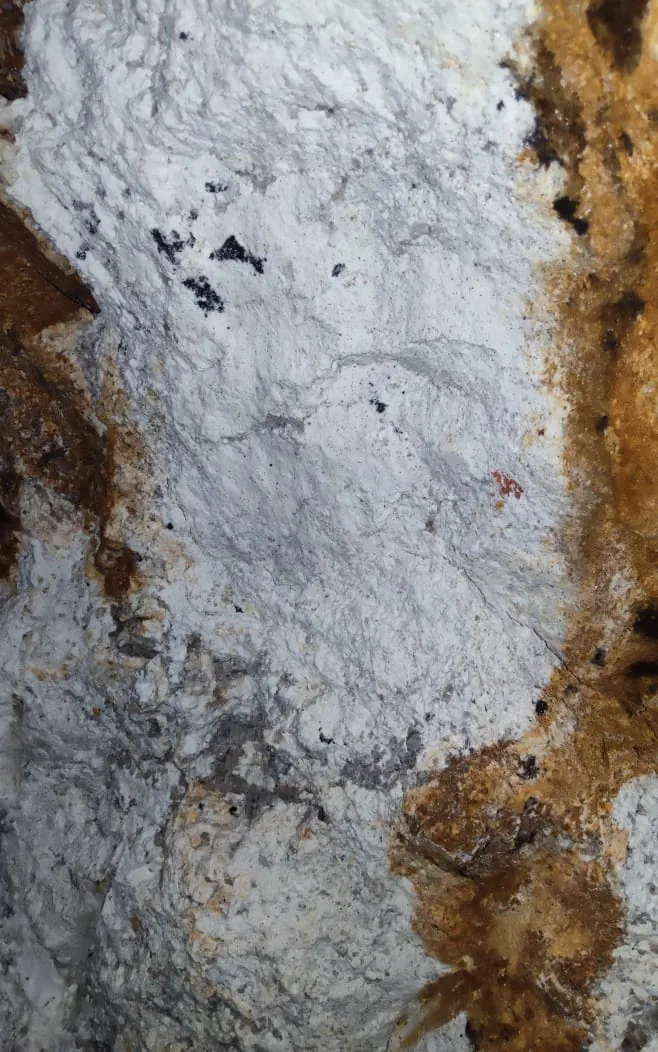Pegmatite vein exposed against schist in gallery wall