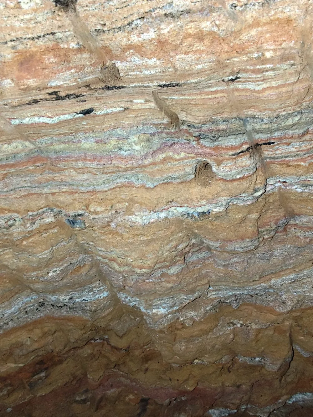Layered pegmatitic vein with quartz-feldspar and mica bands