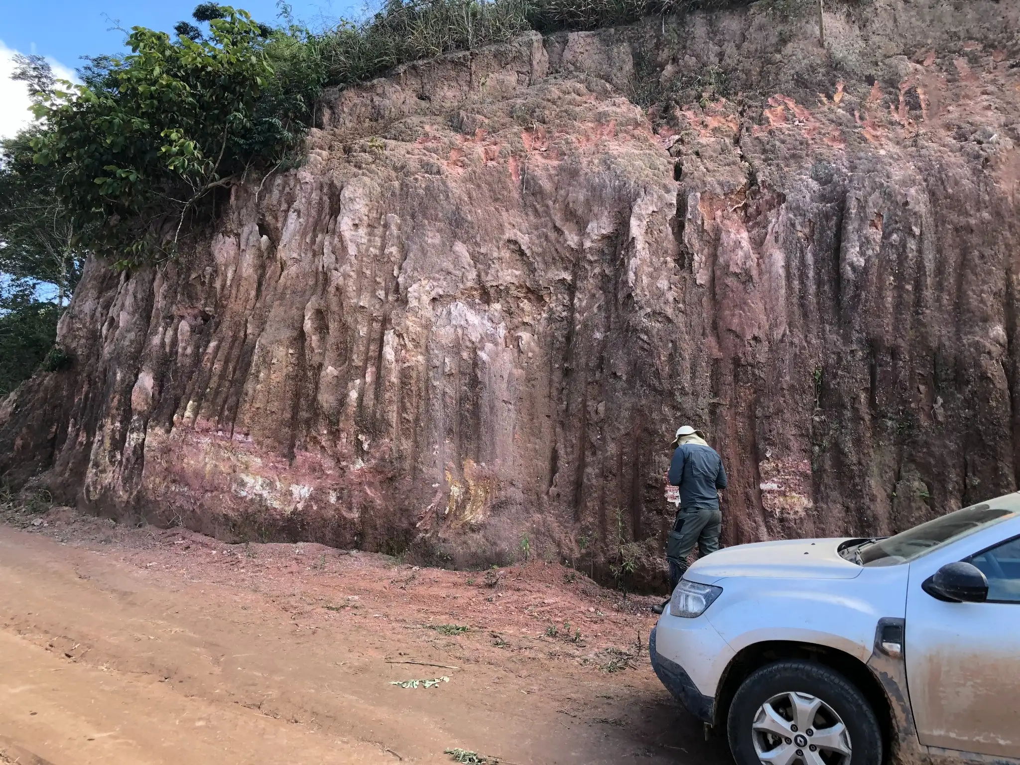 Vertical roadcut exposing a deeply weathered saprolitic profile