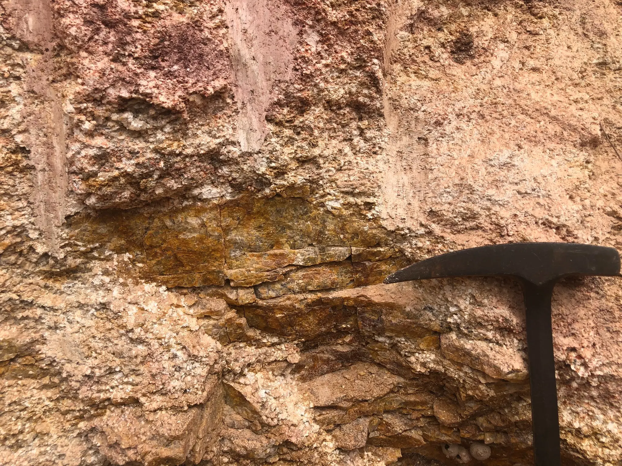 Close-up of oxidized saprolite with relict granitic textures