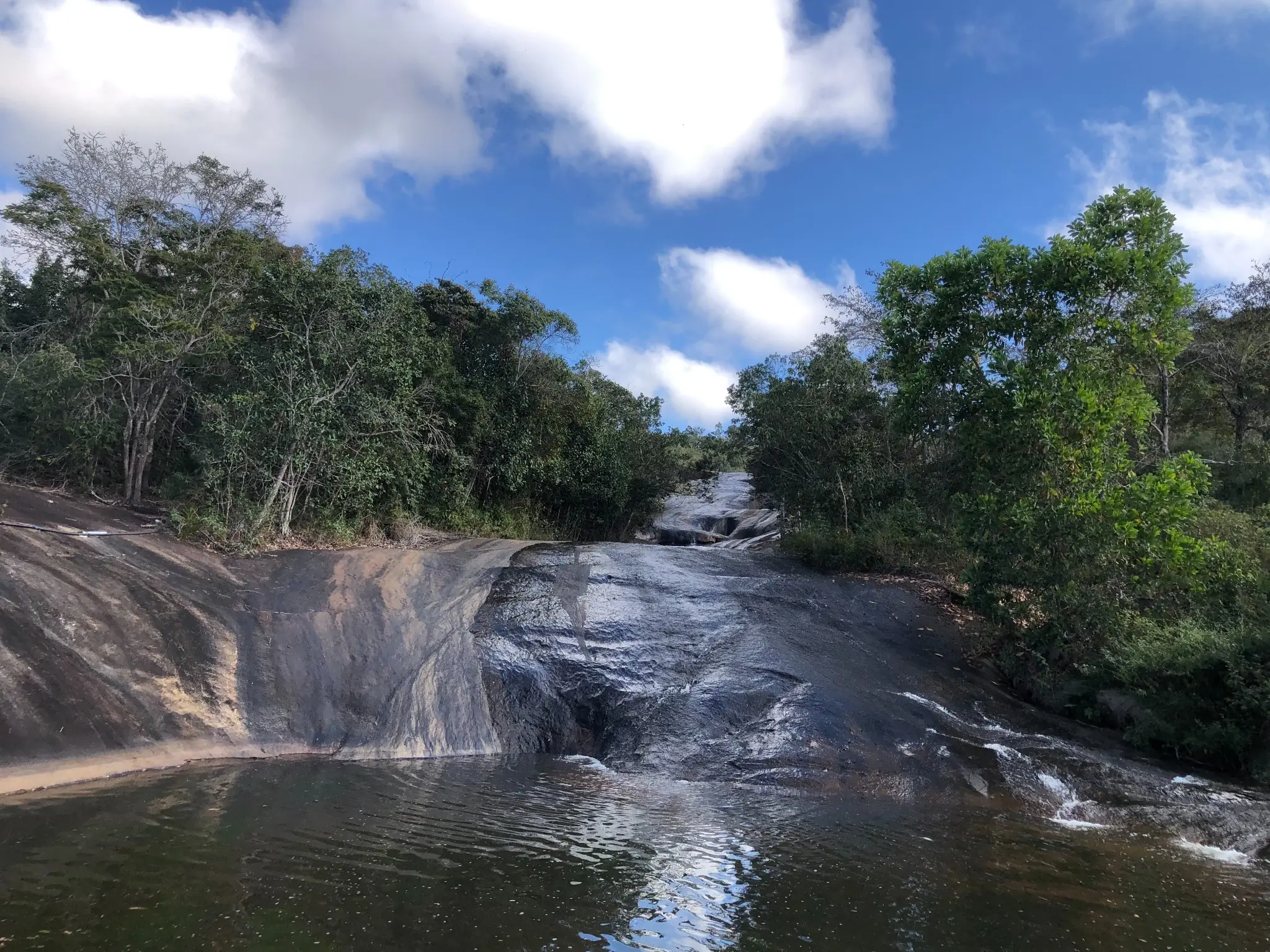 Granite bedrock exposure along a cascading stream near Novo Cruzeiro.