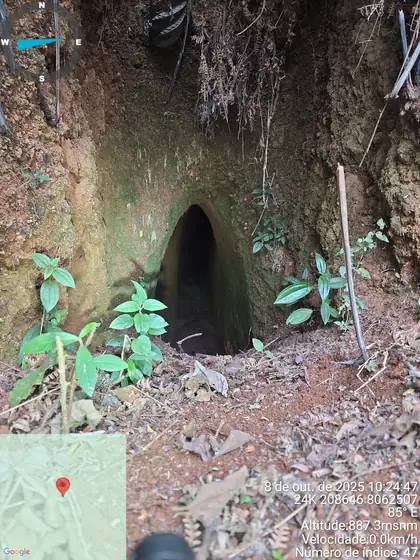Steep, narrow tunnel entrance cut by artisanal miners into the Novo Cruzeiro hillside.